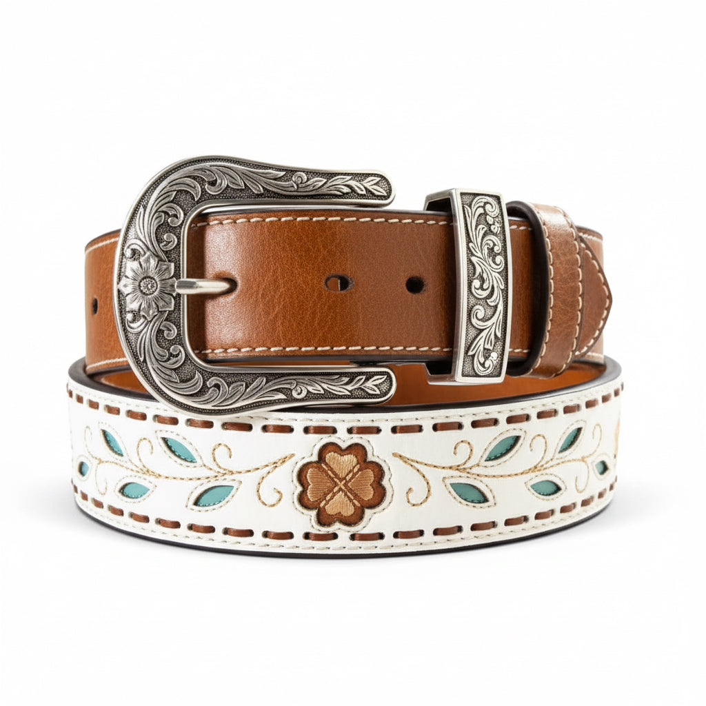 White Ariat ladies belt with filigree flowers, turquoise leaves, and an antique silver floral buckle.