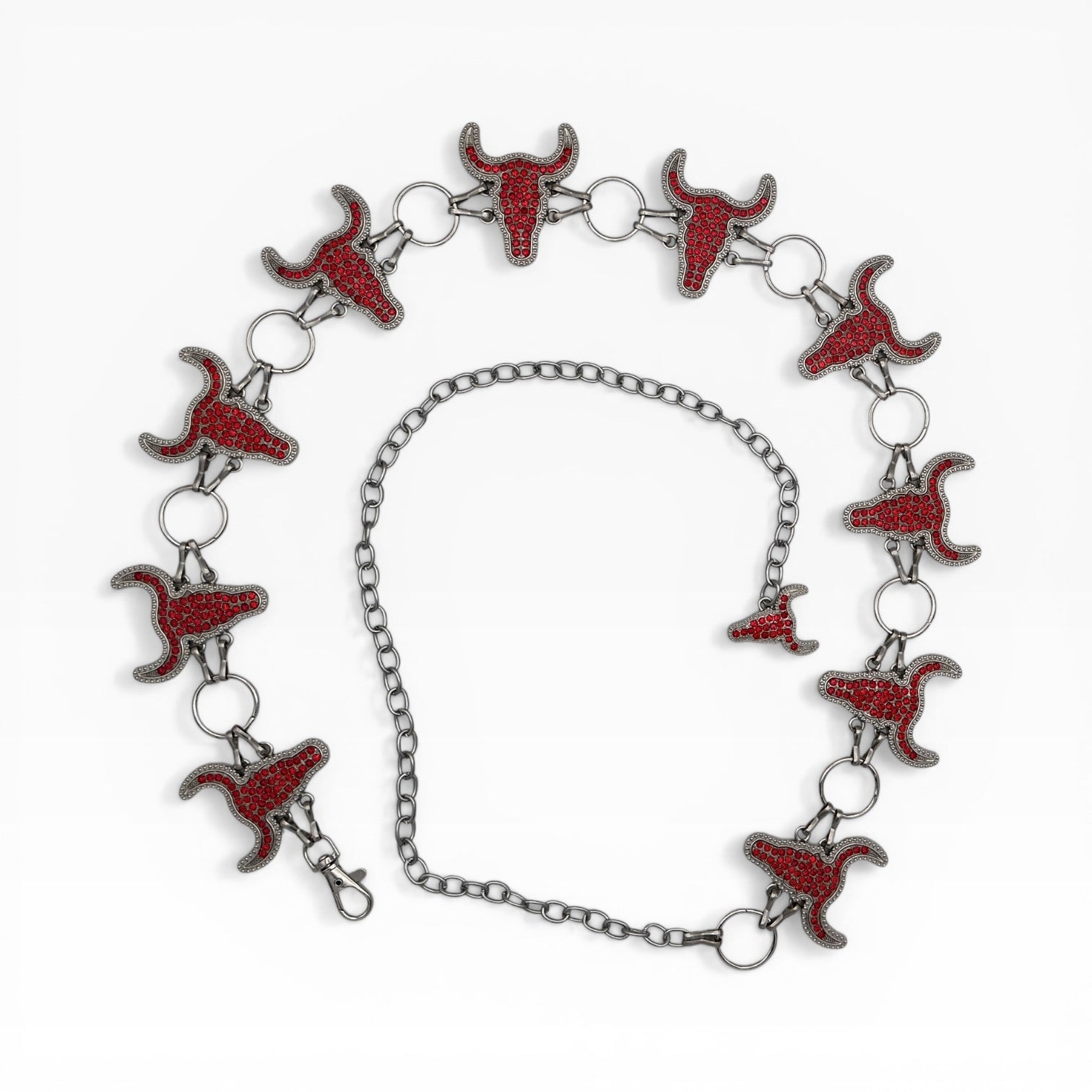 Red rhinestone longhorn skull chain belt with silver rings and adjustable extender.