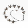 Champagne rhinestone longhorn skull concho chain belt with silver rings and adjustable clasp.