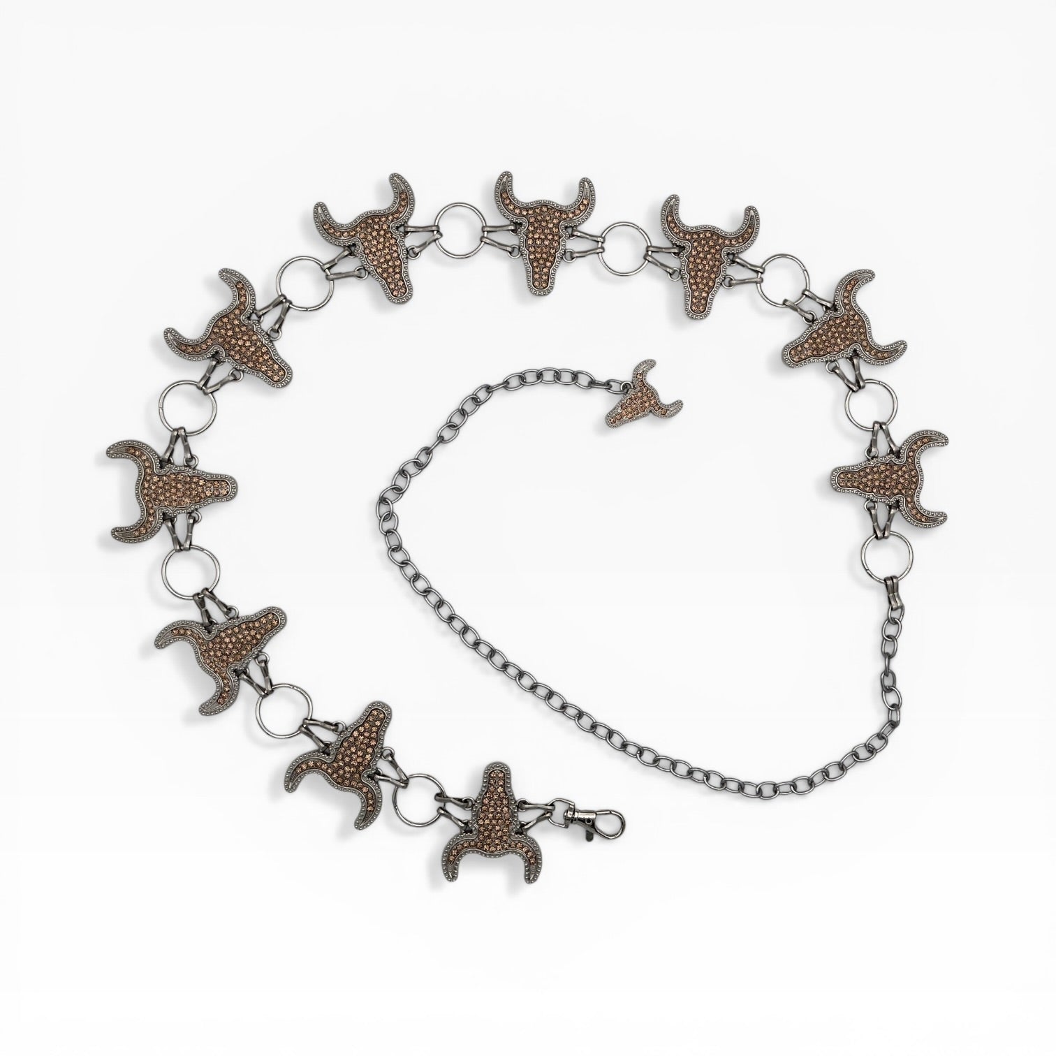 Champagne rhinestone longhorn skull concho chain belt with silver rings and adjustable clasp.