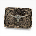 Antique gold western buckle with silver longhorn skull, scrollwork, crystal flowers, and beaded border.