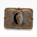 Gold San Judas oval buckle with scrollwork, crystal accents, and a beaded border.