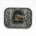 Two-tone silver buckle with gold kneeling cowboy, horse, and cross, surrounded by scrollwork and beaded border.