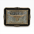 Silver and gold Longhorn Star Midnight Buckle with a gold longhorn skull, scrollwork, and black border.