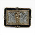 Gold and silver San Judas Tadeo western belt buckle with black border, scrollwork, and star accents.