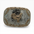 Silver western buckle with a gold rooster, ornate gold scroll border, and silver feather accents.