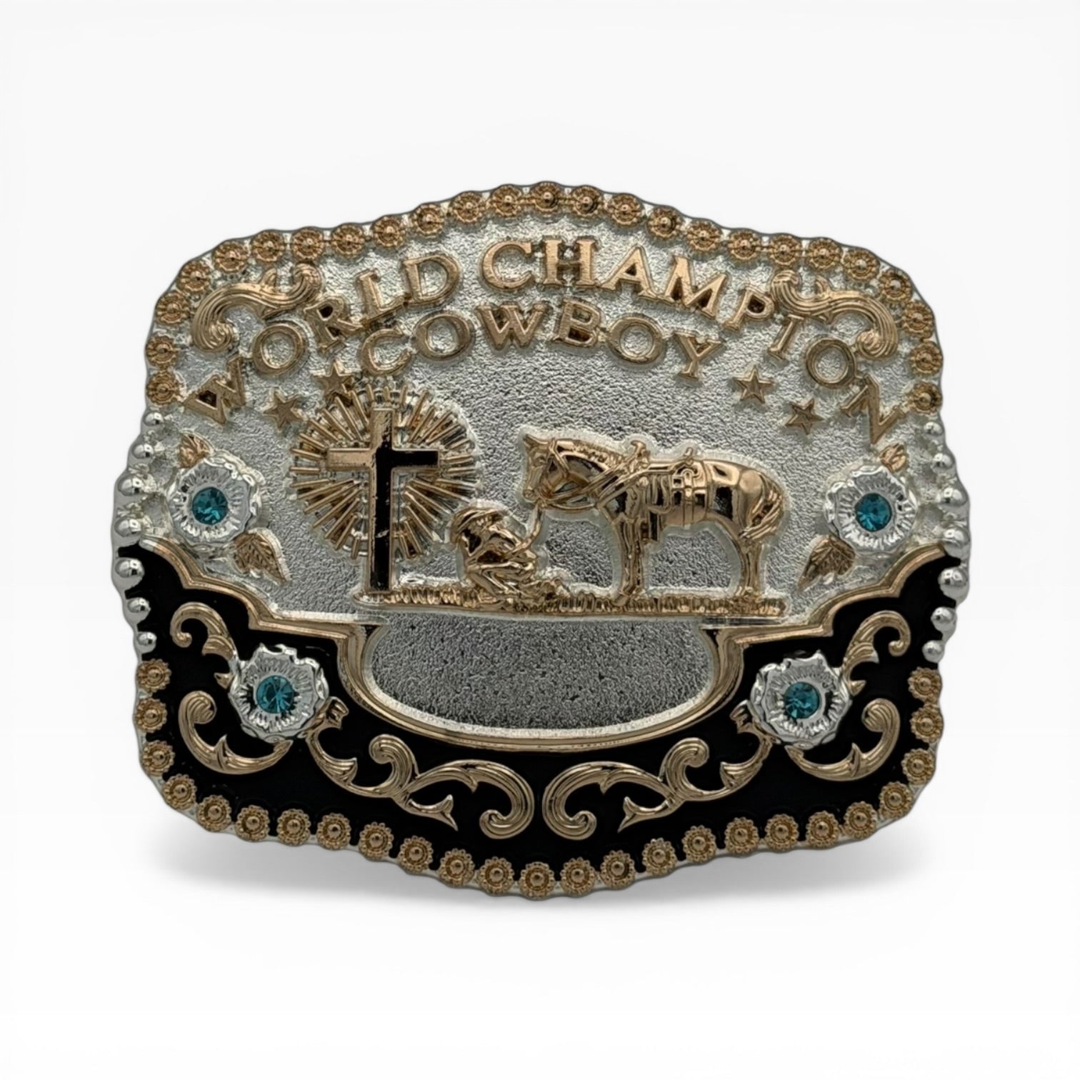 Gold and silver World Champion Cowboy buckle with kneeling cowboy, horse, cross, black enamel, and teal rhinestones.