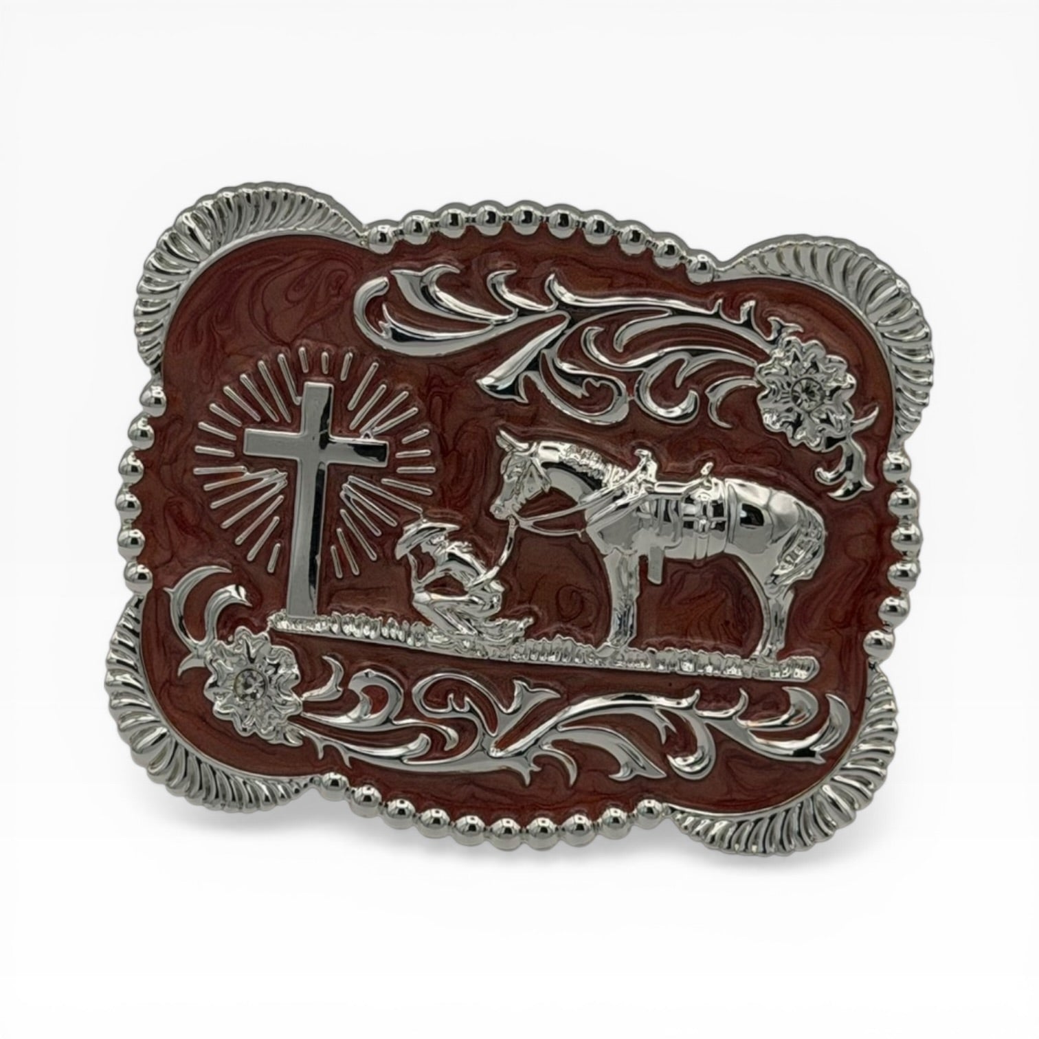 Brown silver scallop buckle with kneeling cowboy, horse, cross, and floral scrollwork.