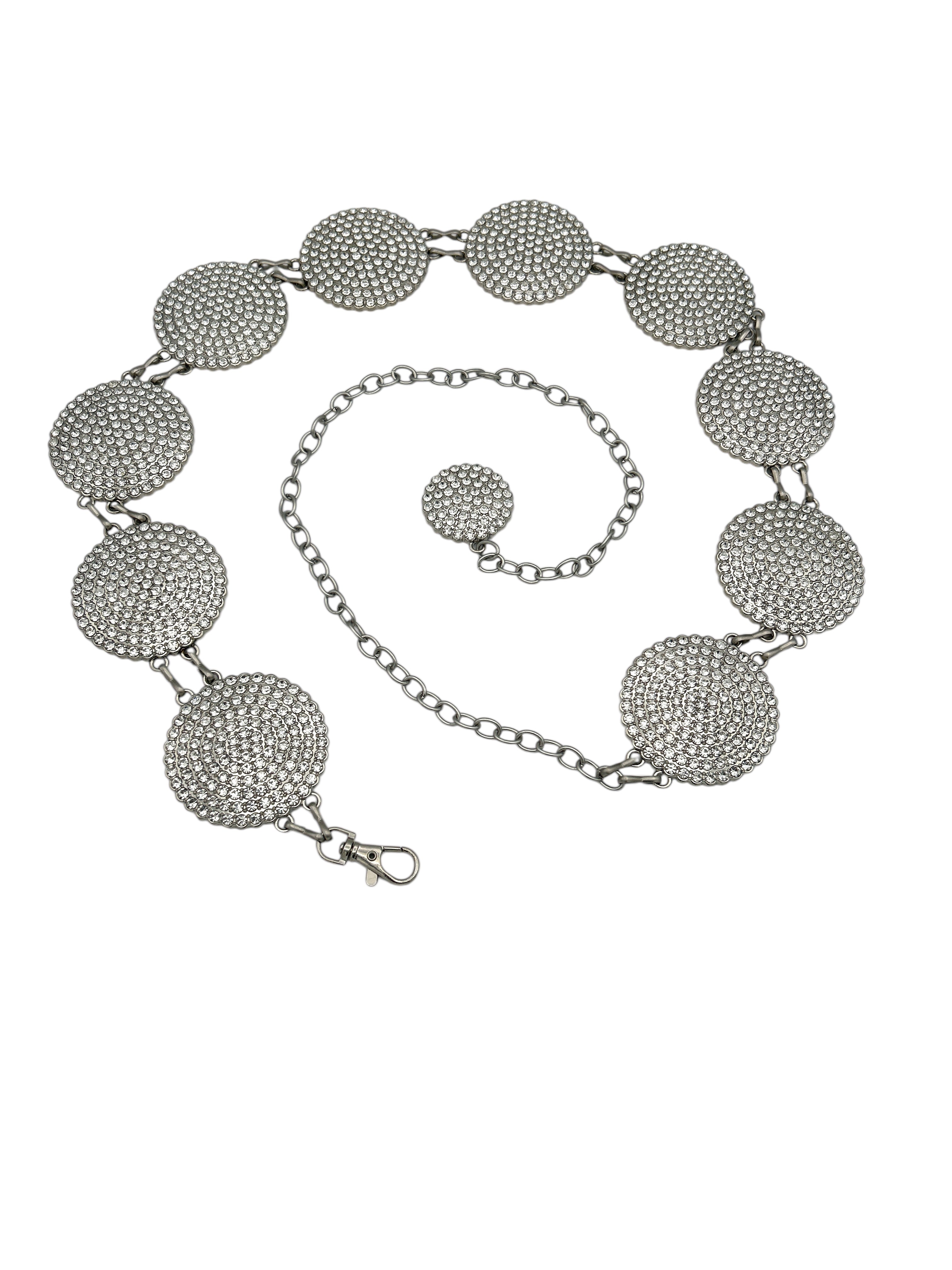Silver Western metal concho belt with round, intricately engraved conchos and an adjustable chain.