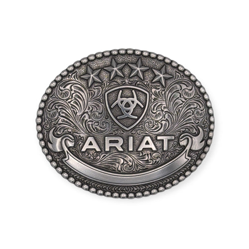 Antique silver Ariat oval buckle with raised stars, shield, ribbon, scrolling background, and beaded edge.