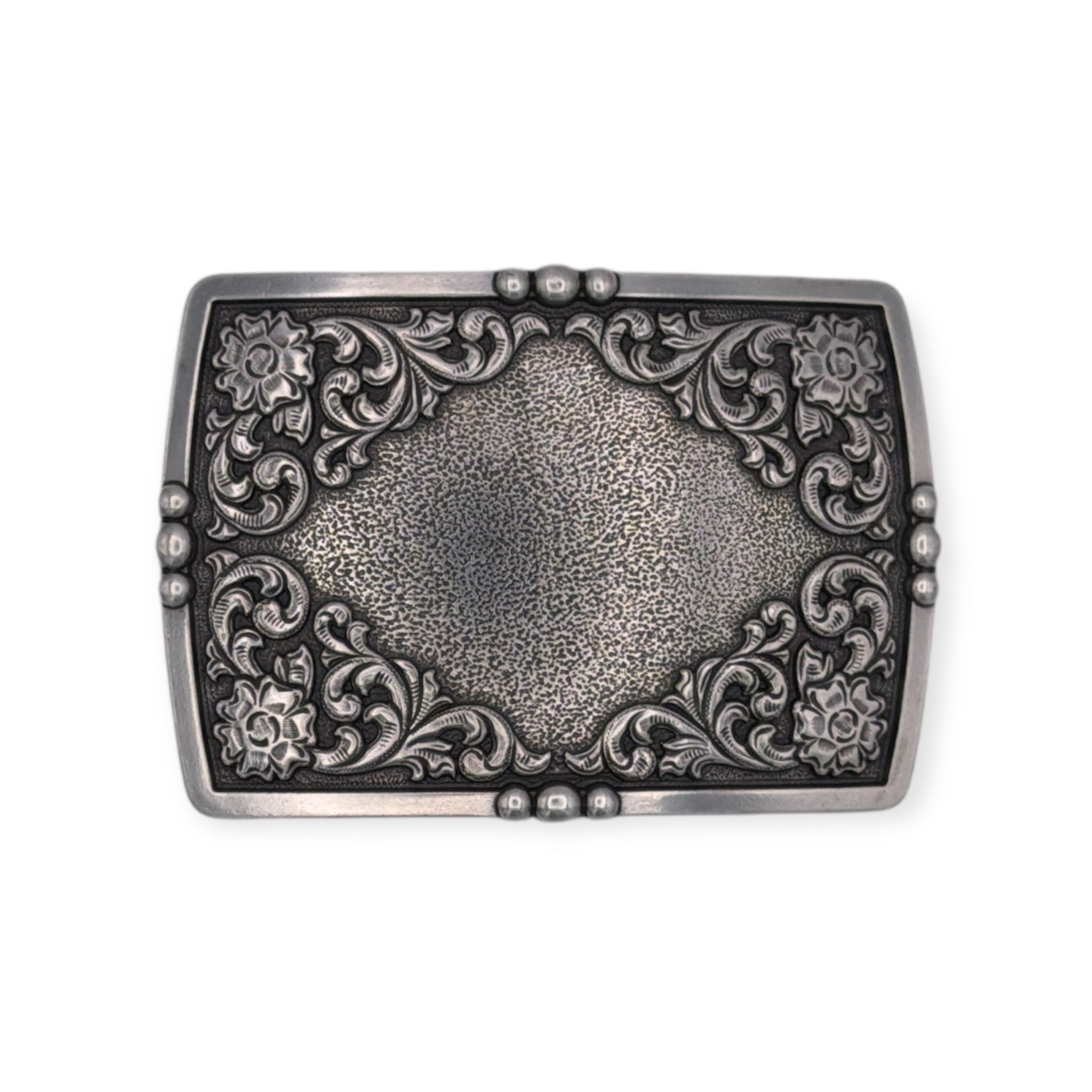 Antique silver Ariat rectangle buckle with raised floral engraving and textured center.