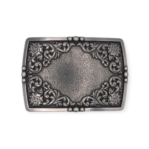Antique silver Ariat rectangle buckle with raised floral engraving and textured center.