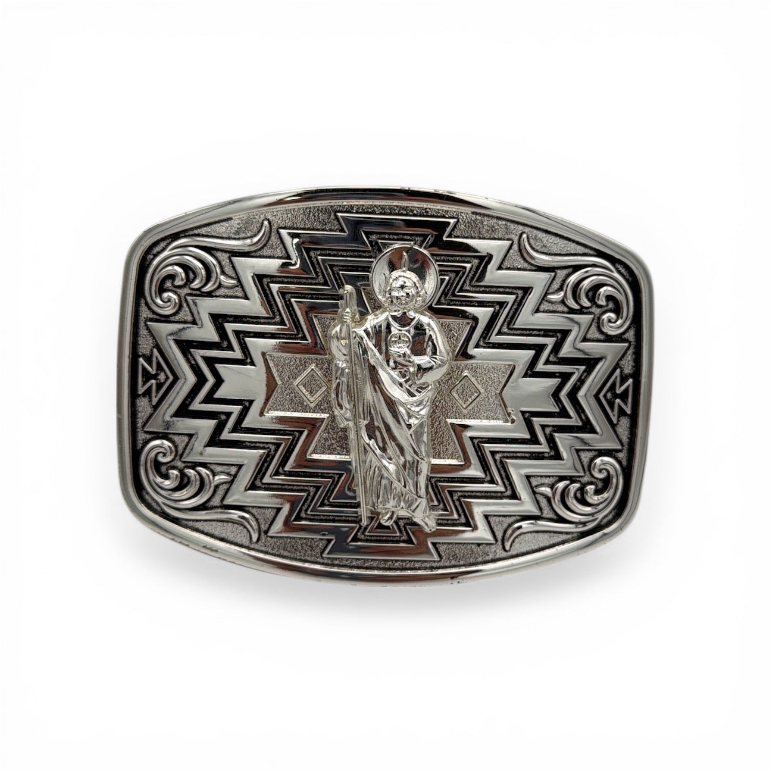 Polished silver tone San Judas belt buckle with bold southwestern geometric and western scroll engravings.
