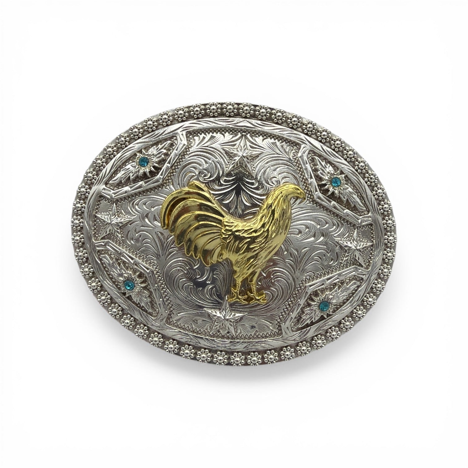 Oval silver western buckle with gold rooster, scrollwork, stars, turquoise stones, and beaded border.