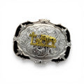 Silver and gold oval Cowboy Prayer Buckle with a kneeling cowboy, horse, and cross, framed by black accents.