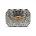 Gold longhorn skull on engraved silver western buckle with pink stone border.