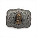 Gold Virgin Mary on silver western buckle with pink stone border and scroll engraving.