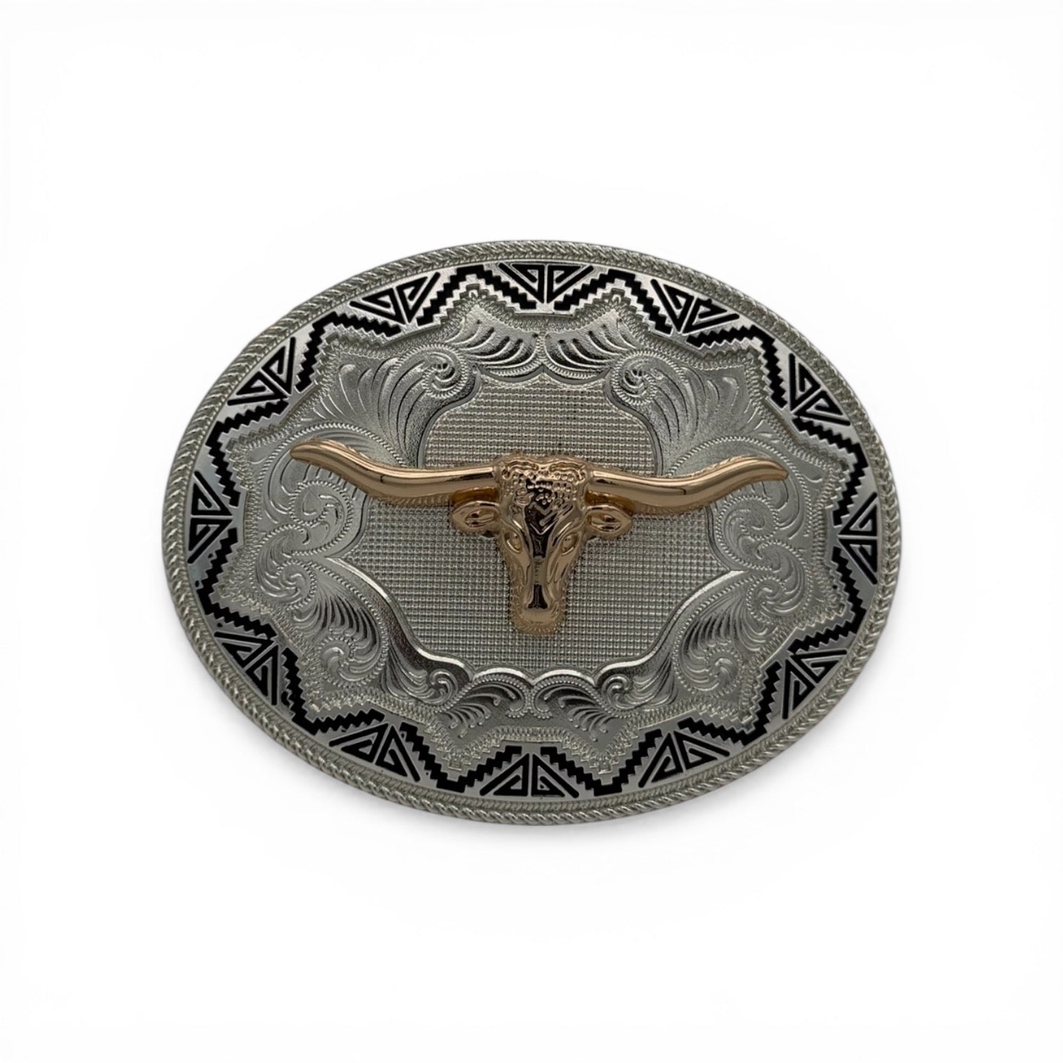 Oval two-tone metal buckle with gold longhorn head, silver scrollwork, and black Aztec border.